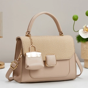 Elegant beige crossbody bag with straw texture contrast and golden square buckle
