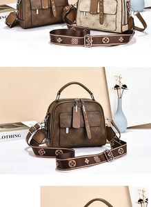 Detail of vintage Boston handbag with printed faux leather and wide jacquard strap