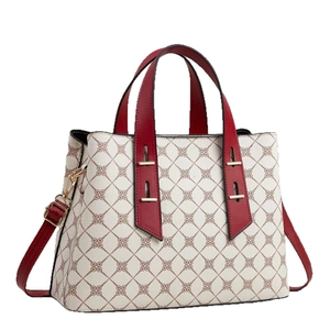 Elegant white tote bag with reddish-brown diamond pattern and dark red leather handles