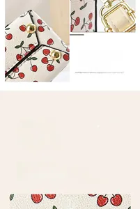Close-up of cherry print PU leather material with gold studs and D-ring hardware