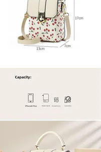 Detail view of cherry print mini bag showing 17x13x7cm size and daily essentials capacity