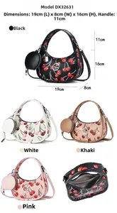 Detail view of half-moon cherry print crossbody bag with detachable round coin purse