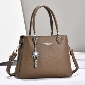 Large capacity brown litchi leather handbag with shoulder strap and floral charm