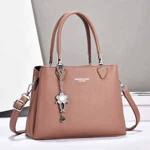 Chic lotus pink leather tote bag with large capacity and detachable strap on white stand