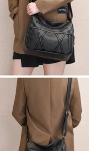 Détail du sac bandoulière en cuir noir grainé avec poches zippées et coutures croisées