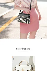 Detail of floral and white PU leather handbags featuring dual swan metal buckles and straps