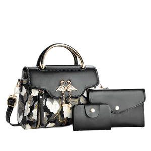 Black three-piece handbag set with floral patterns and gold swan pearl buckle