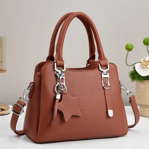 Brown litchi grain leather tote bag with star charm and silver hardware for women