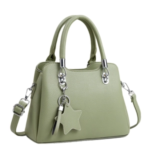 Chic bean green pebble leather crossbody bag with star charm and adjustable strap