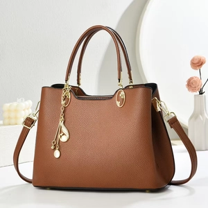 Brown lychee texture leather handbag with gold pearl pendant charm and shoulder strap