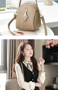 Detail of lychee pattern leather and gold zippers on a mini multi-pocket crossbody bag