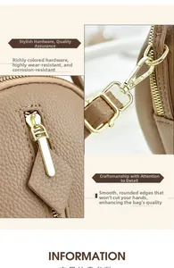 Detail of brown litchi pattern leather texture and high-quality gold hardware on handbag
