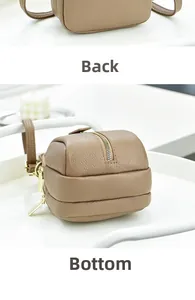 Detail view of brown lychee grain leather mini bag with gold zipper and back side view