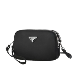 Three-layer black nylon crossbody camera bag for women with adjustable strap and logo