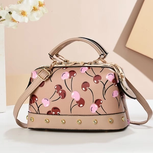 Elegant cherry print satchel bag in beige PU leather with gold rivets and long strap