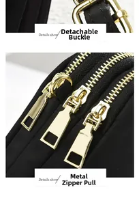 Detail showing the golden metal zippers and detachable clasp on a black crossbody bag