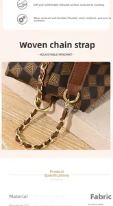 Detail of woven chain strap and checkerboard pattern fabric on brown shoulder bag