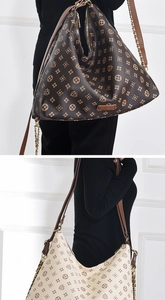 Detail view of retro geometric print hobo bags with leather-metal chain straps