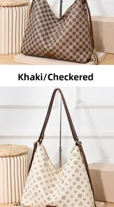 Close-up of khaki checkered and floral print shoulder bags with gold chain details