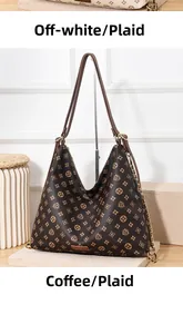 Detail view of coffee-colored monogram hobo bag with gold chain and leather strap
