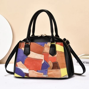 Fashionable colorful patchwork tote bag in black pebbled leather with a crossbody strap