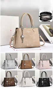 Detailed view of the structured interior and dimensions of the minimalist shoulder bag