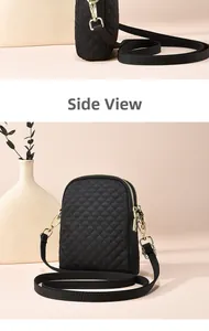 Detail view of black quilted crossbody bag showing side profile and golden zipper