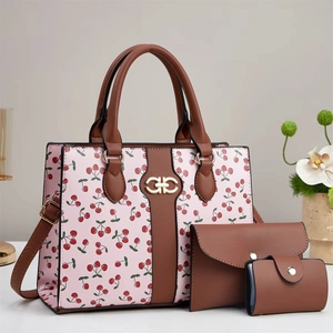 Pink cherry print 3-piece handbag set featuring a large tote, wallet, and small pouch