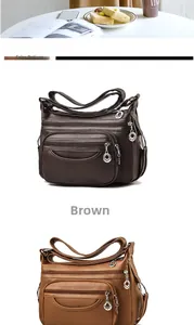 Detail view of large capacity PU leather shoulder bag with multiple zipper pockets