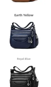 Detail view of multi-pocket soft PU leather crossbody bags in royal blue and black colors