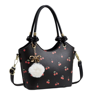 Fashionable black cherry print bucket bag with plush charm and golden bow detail