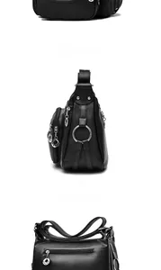 Detail view showing black litchi pattern leather texture and silver star zipper on crossbody bag