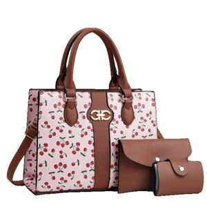 Pink cherry print tote bag set with brown trim and horseshoe metal hardware accessory