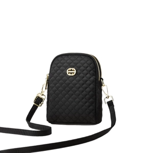 Black quilted oxford fabric crossbody bag with gold logo and adjustable shoulder strap
