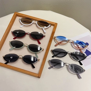 Collection of seven retro cat eye sunglasses with metal frames in various colors