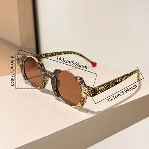 Detail view showing tortoise shell frame dimensions and geometry of the round sunglasses
