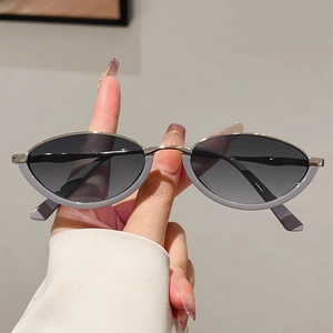 Detailed view of retro oval semi-rimless sunglasses with metal frame and gradient lenses
