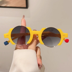 Fashionable thick yellow round frame sunglasses with unique colorful sphere temple accents