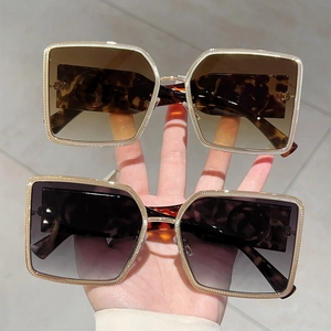 Modern square metal sunglasses with tortoiseshell accents and gradient lenses