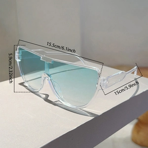 Detail view of large aviator sunglasses with transparent frame and blue gradient lenses