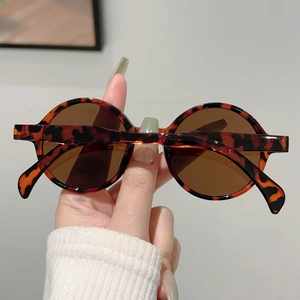 Close-up of retro round tortoiseshell sunglasses with brown UV protective lenses