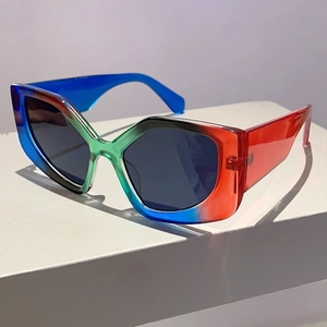 Detailed view of colorful gradient geometric frame sunglasses on a white display pedestal
