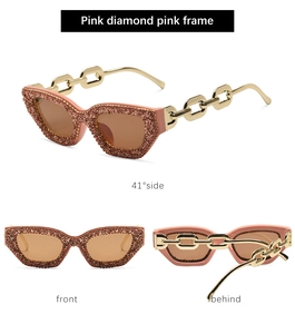 Details der rosa Katzenaugen-Sonnenbrille mit Diamantrahmen und Goldketten-Bügeln