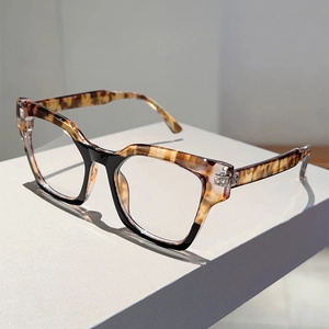 Detail of cat-eye frame featuring elegant black and tortoiseshell color blocking