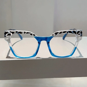 Detailed close-up of cat-eye glasses frame with leopard print and blue gradient finish