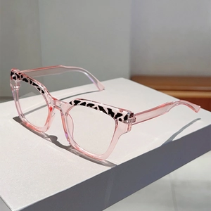 Detailed side view of pink transparent cat-eye frames with stylish leopard print accents