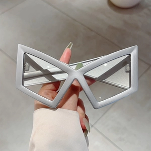 Futuristic silver geometric X-shaped frame sunglasses with Y2K cyberpunk style design