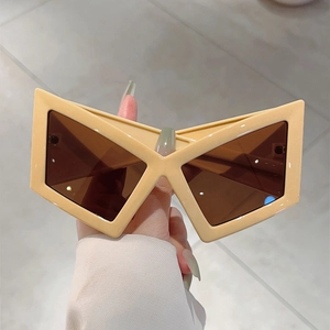 Modern beige geometric X-shaped wrap sunglasses with oversized futuristic resin frames