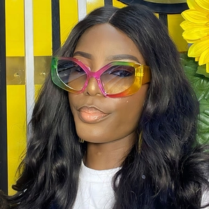 Fashionable oversized cat eye sunglasses with a colorful gradient frame and tinted lenses