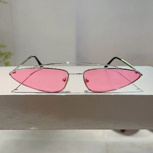 Front detail of triangle sunglasses with pink lenses and silver metal double bridge frame